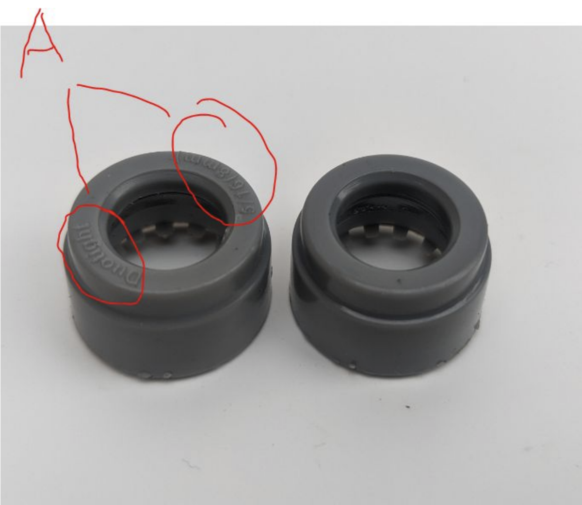 Top-down view of two DuoTight collars; the left fitting shows chalky surface degradation marked with a red annotation, the right is undamaged